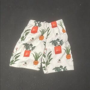 Nike Men's White Shorts with Orange and Green Pattern